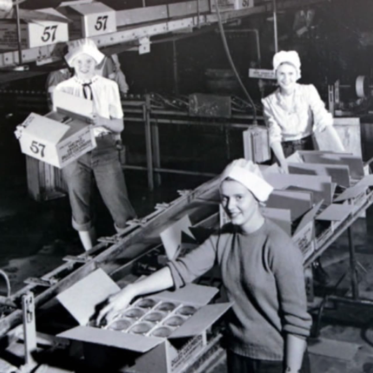 A black and white photo of women working in the Heinz factory.