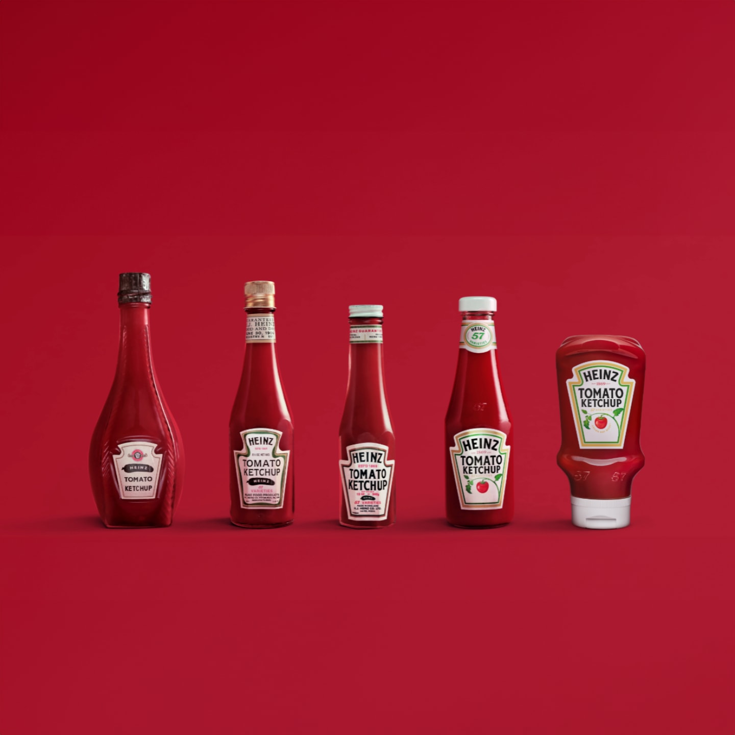 A row of Heinz ketchup bottles depicting the evolution of how the bottle has changed over the years.