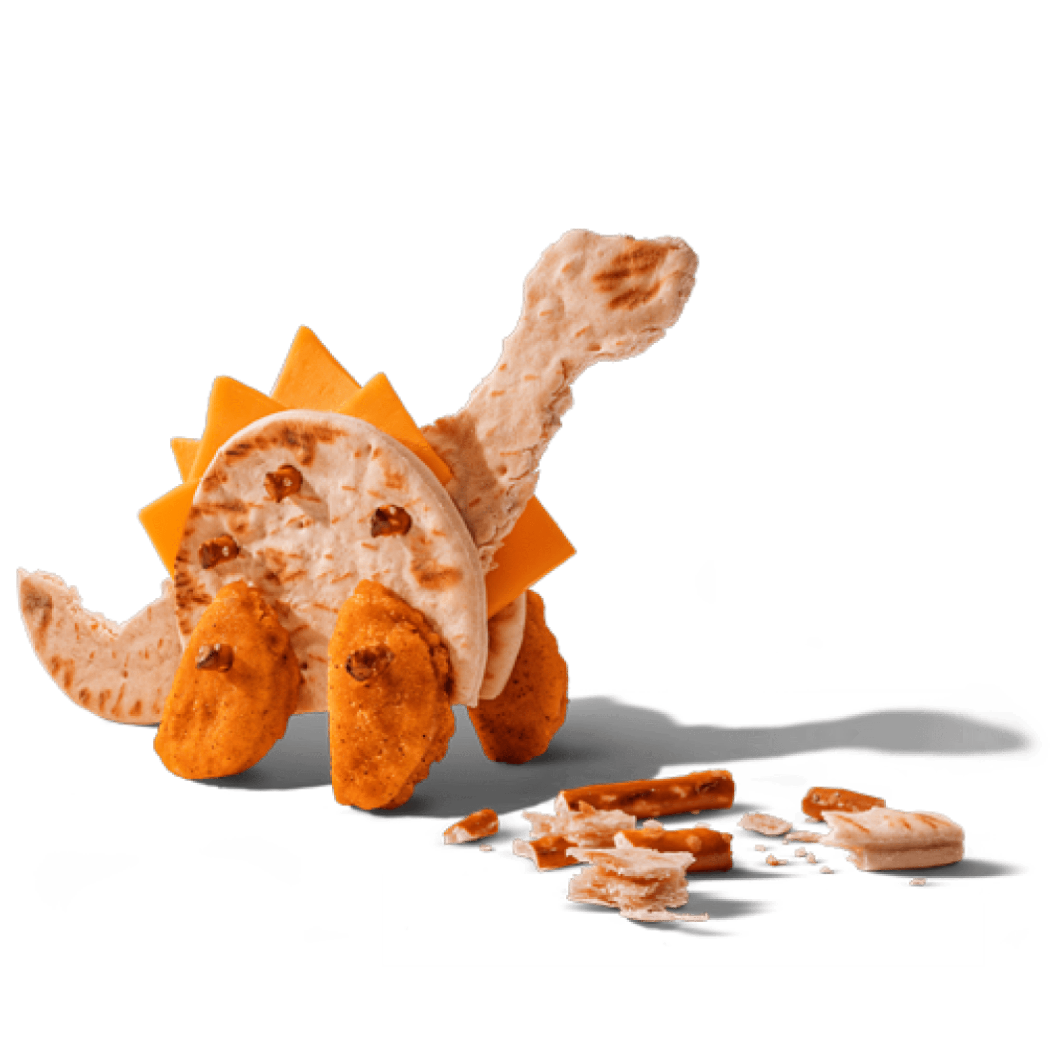 A dinosaur made of pita bread, cheese, and chicken nuggets on a black background.