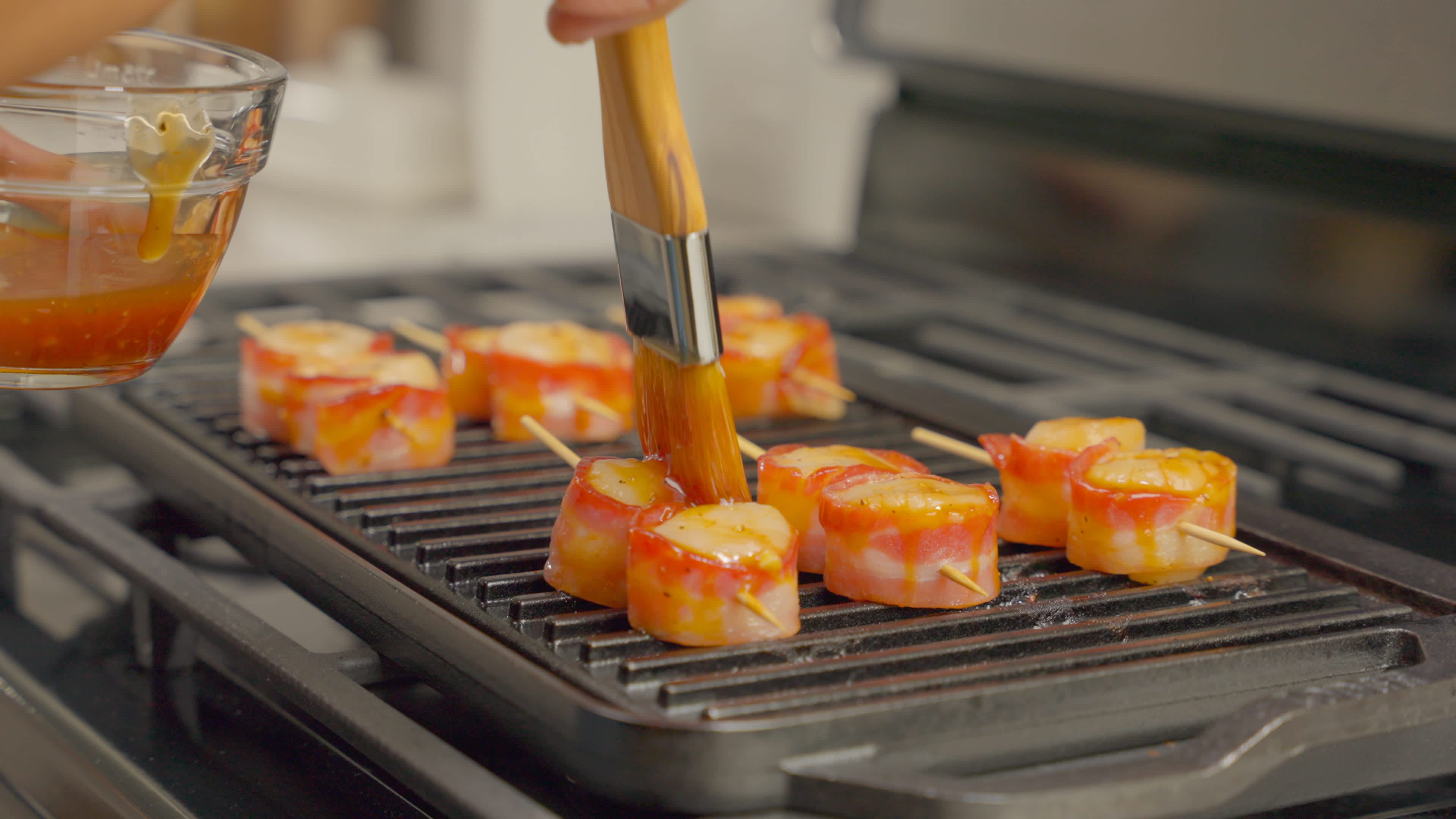 Grill bacon-scallop kabobs for 3 to 5 min until cooked.