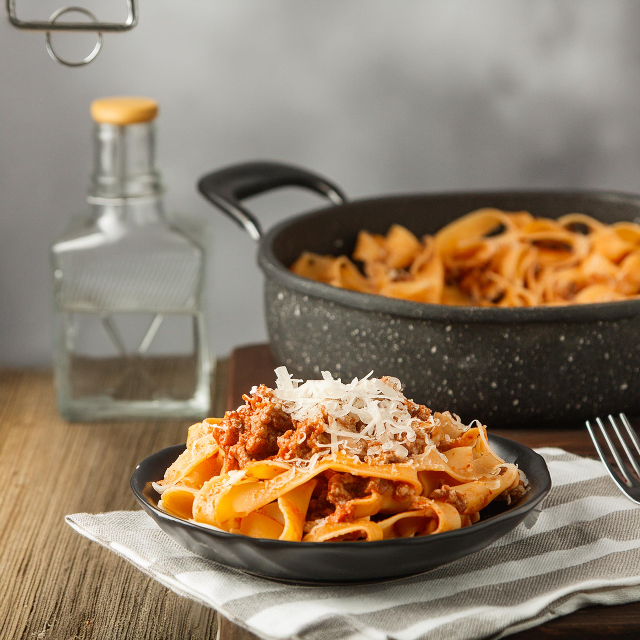 Long ribbon pasta topped with a thick BBQ meat sauce and grated parmesan cheese.