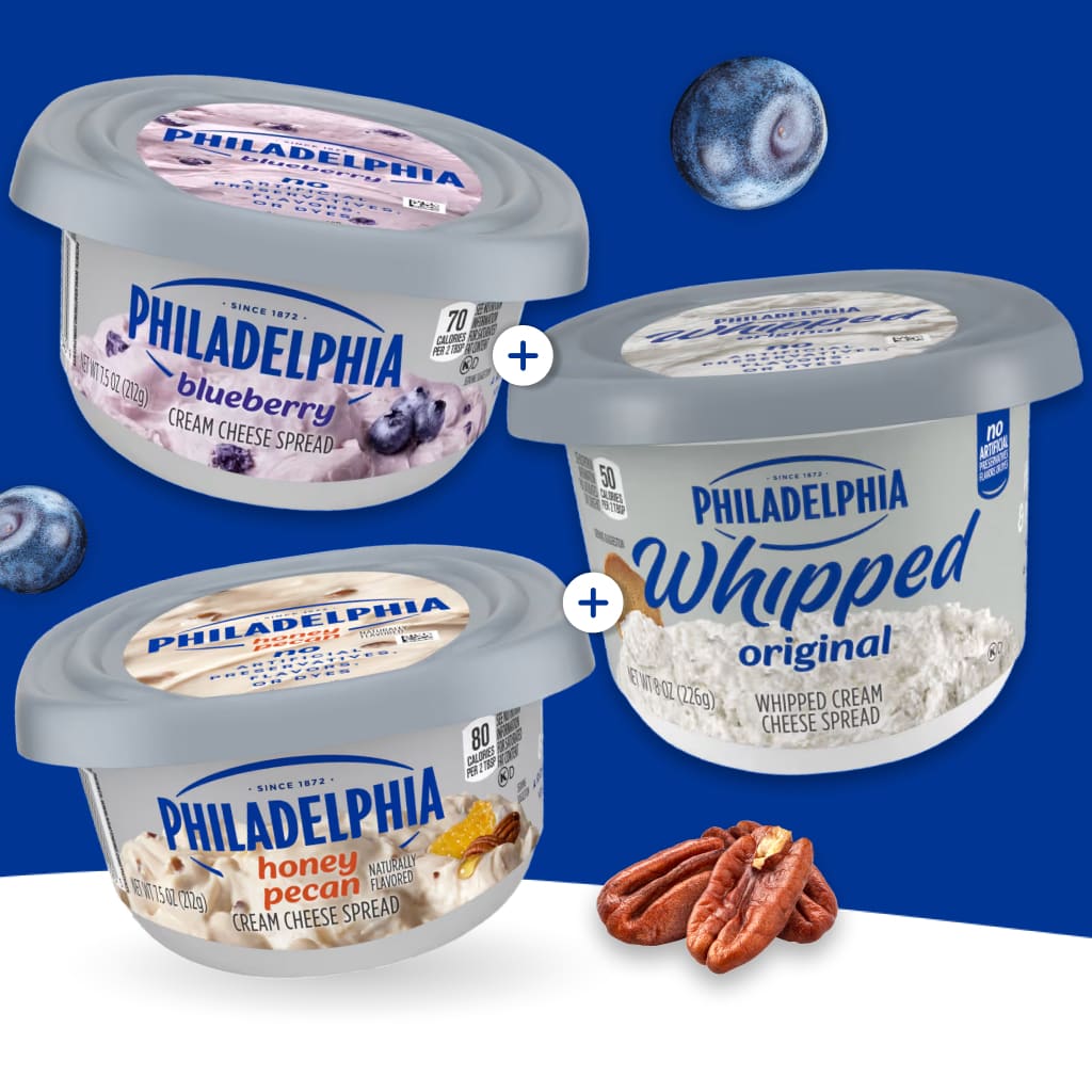 Three Philadelphia cream cheese spreads: Blueberry, Original Whipped, and Honey Pecan, with scattered blueberries and pecans.