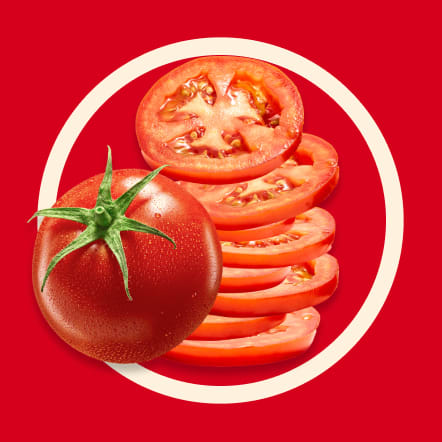 A whole tomato and a stack of thin tomato slices are presented on a vibrant red background, enclosed in a contrasting off-white circle. This image represents sixteen servings for a recipe.