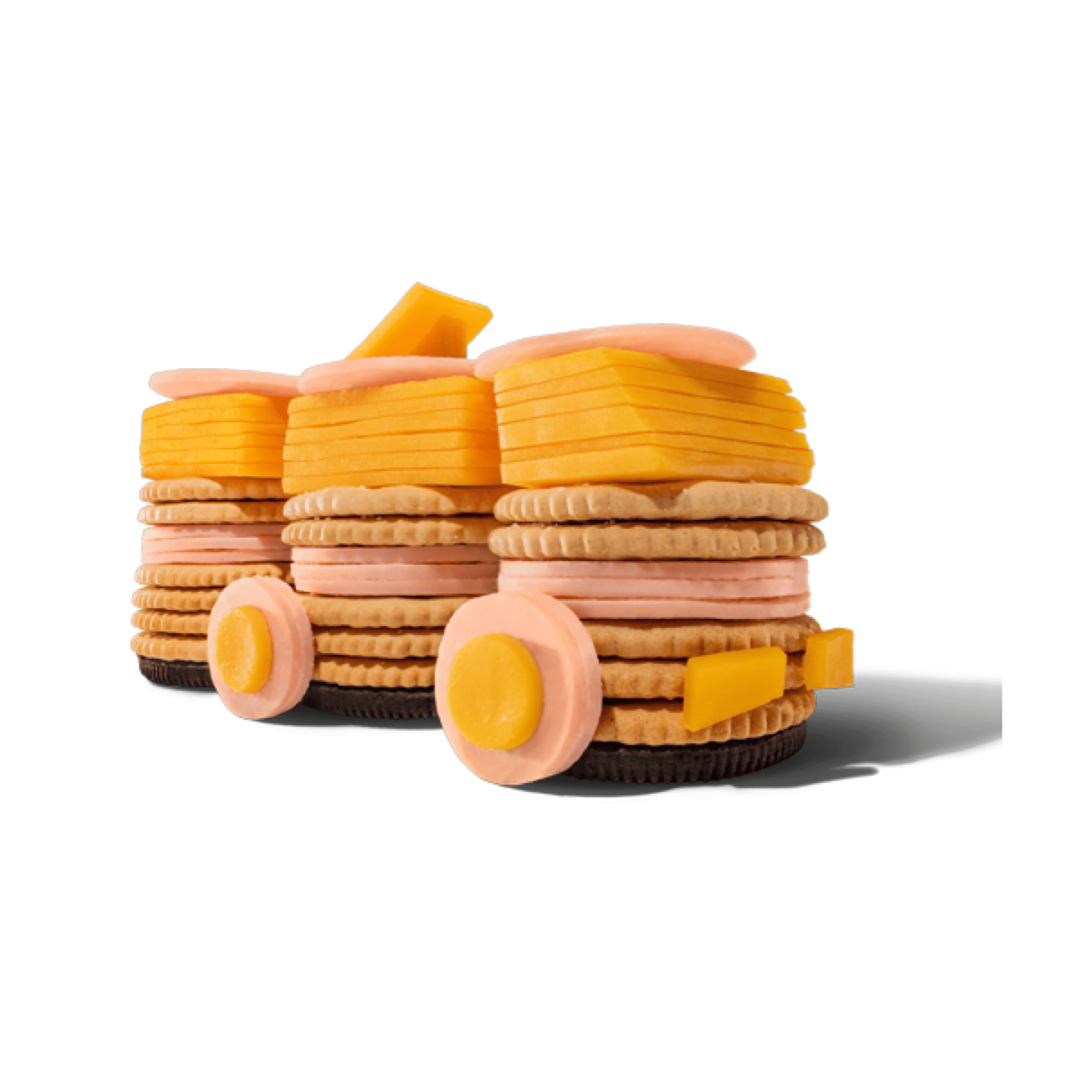 Stacks of crackers, cheese, and meat resembling train cars on a black background.