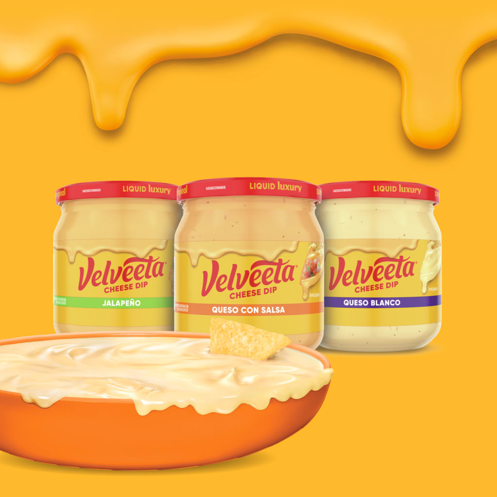 Velveeta Cheese Dip jars (Jalapeño, Queso con Salsa, Queso Blanco) with a bowl of creamy dip.