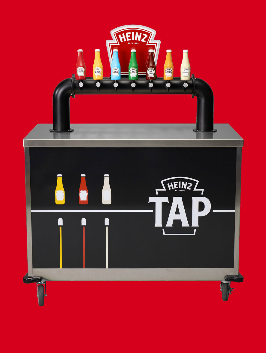A Heinz Tap Machine over a red background