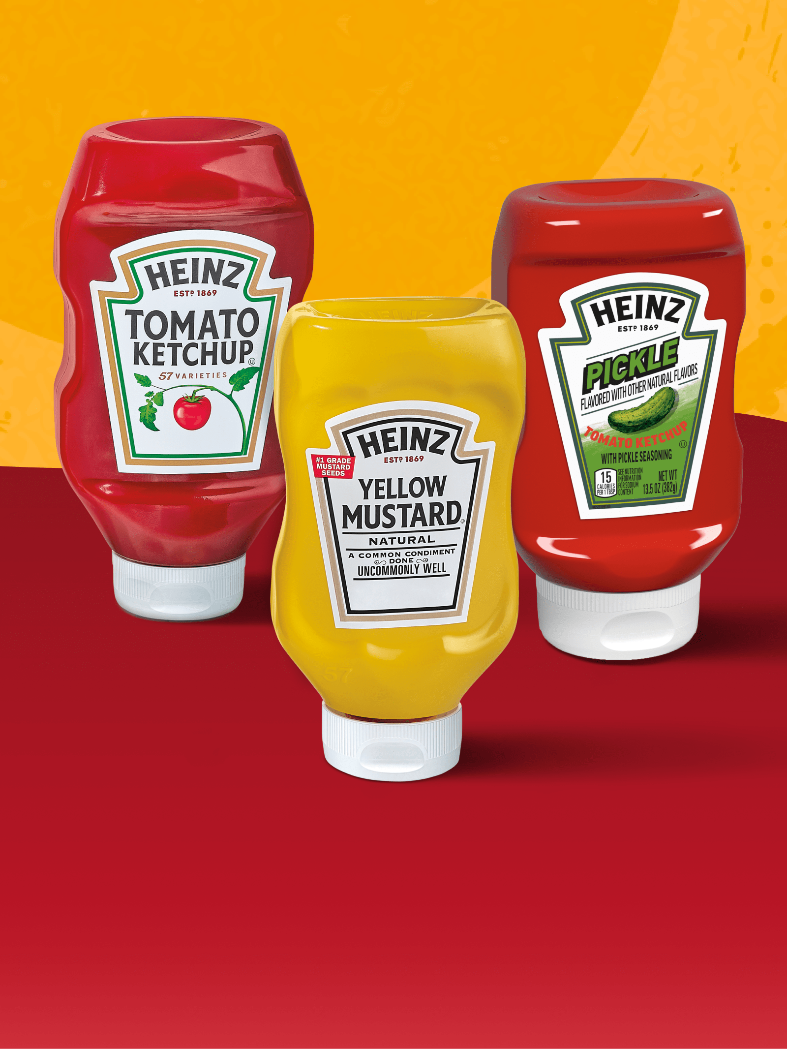 Three Heinz squeeze bottles: Tomato Ketchup, Yellow Mustard, and Pickle Ketchup.