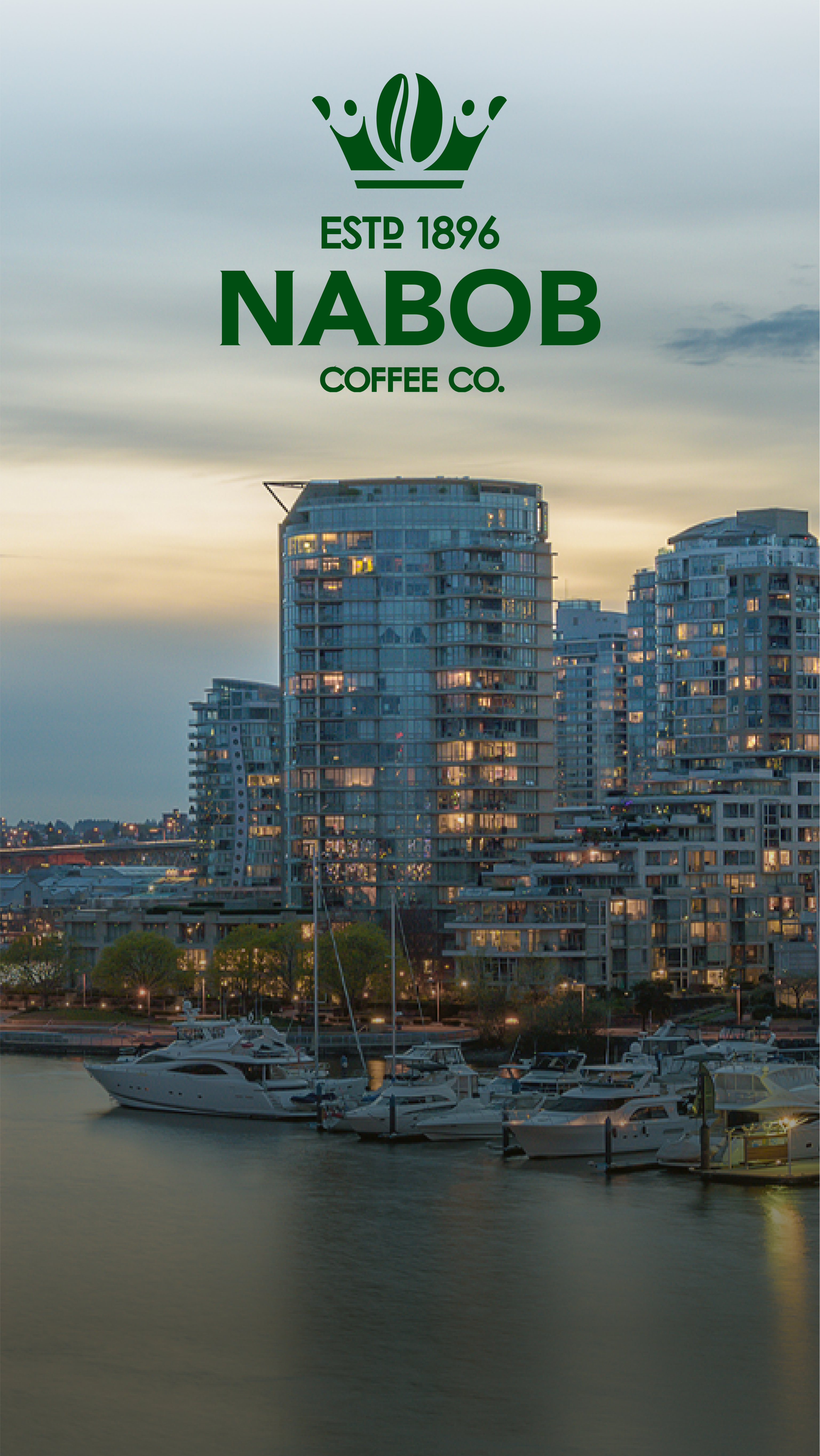 Logo de Nabob Coffee Co. sur un paysage urbain au coucher du soleil