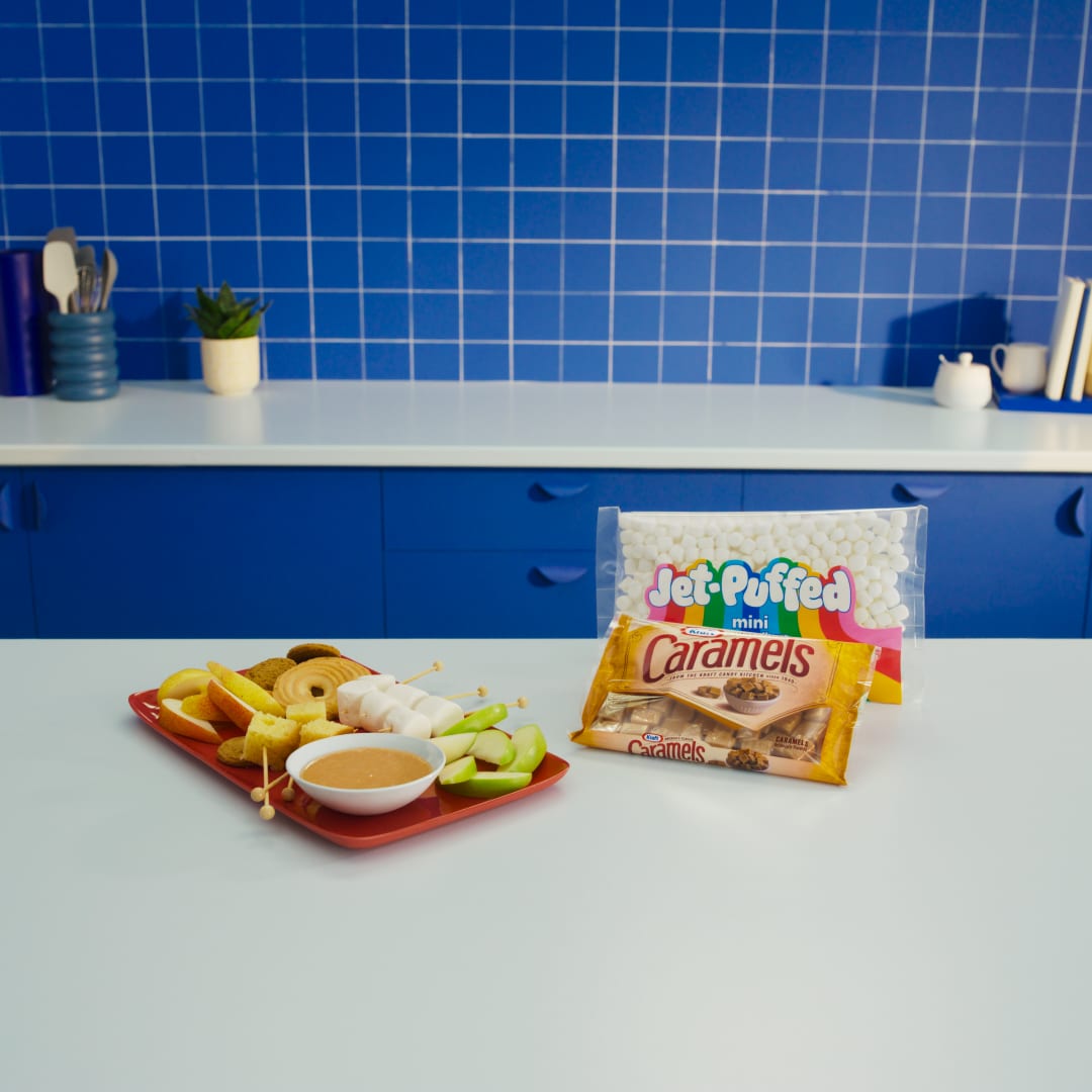 Jet-Puffed mini marshmallows, Kraft Caramels, apples, and cookies for a fun snack platter with dip.