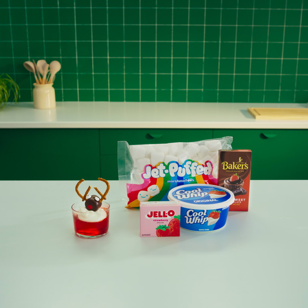 Jell-O, Jet-Puffed marshmallows, Cool Whip, and Baker's ingredients for festive reindeer dessert cups.
