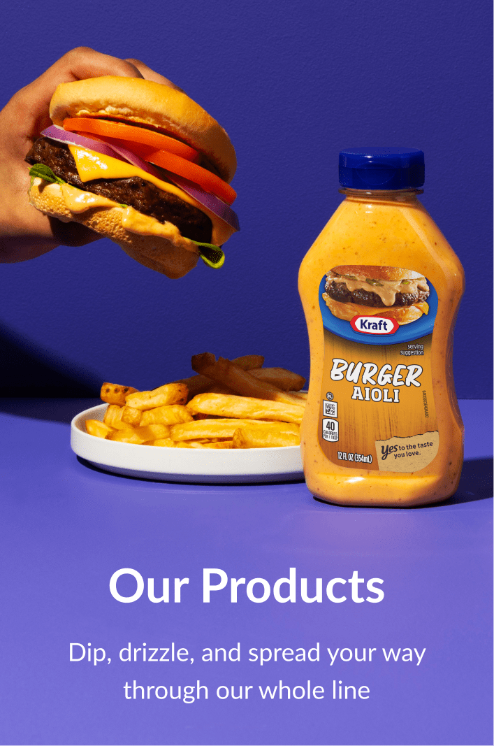 Kraft Burger Aioli bottle next to a burger and fries on a vibrant purple background.