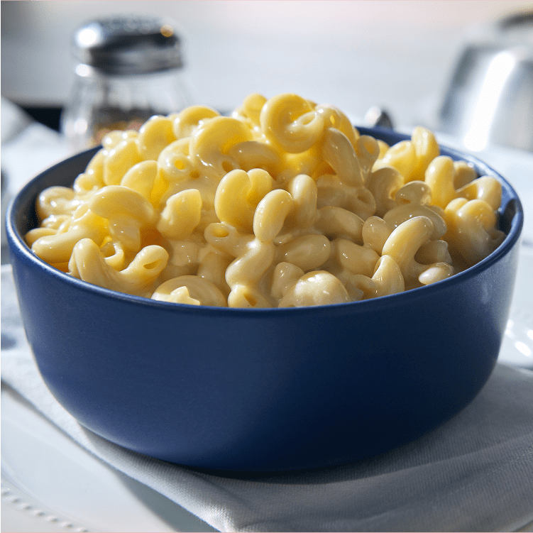 Creamy Kraft Mac & Cheese served in a blue bowl, a comforting and delicious family meal.