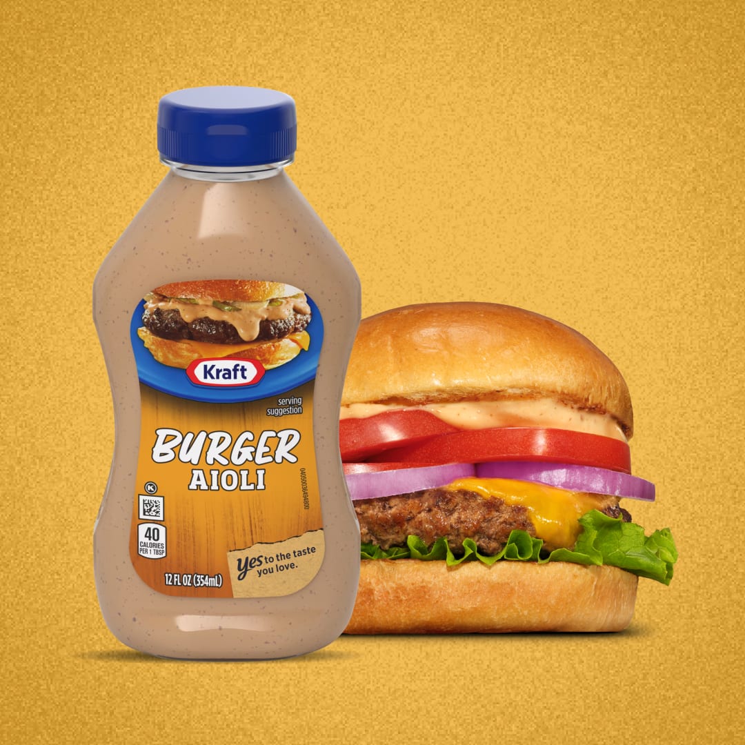 Kraft Burger Aioli bottle next to a burger.