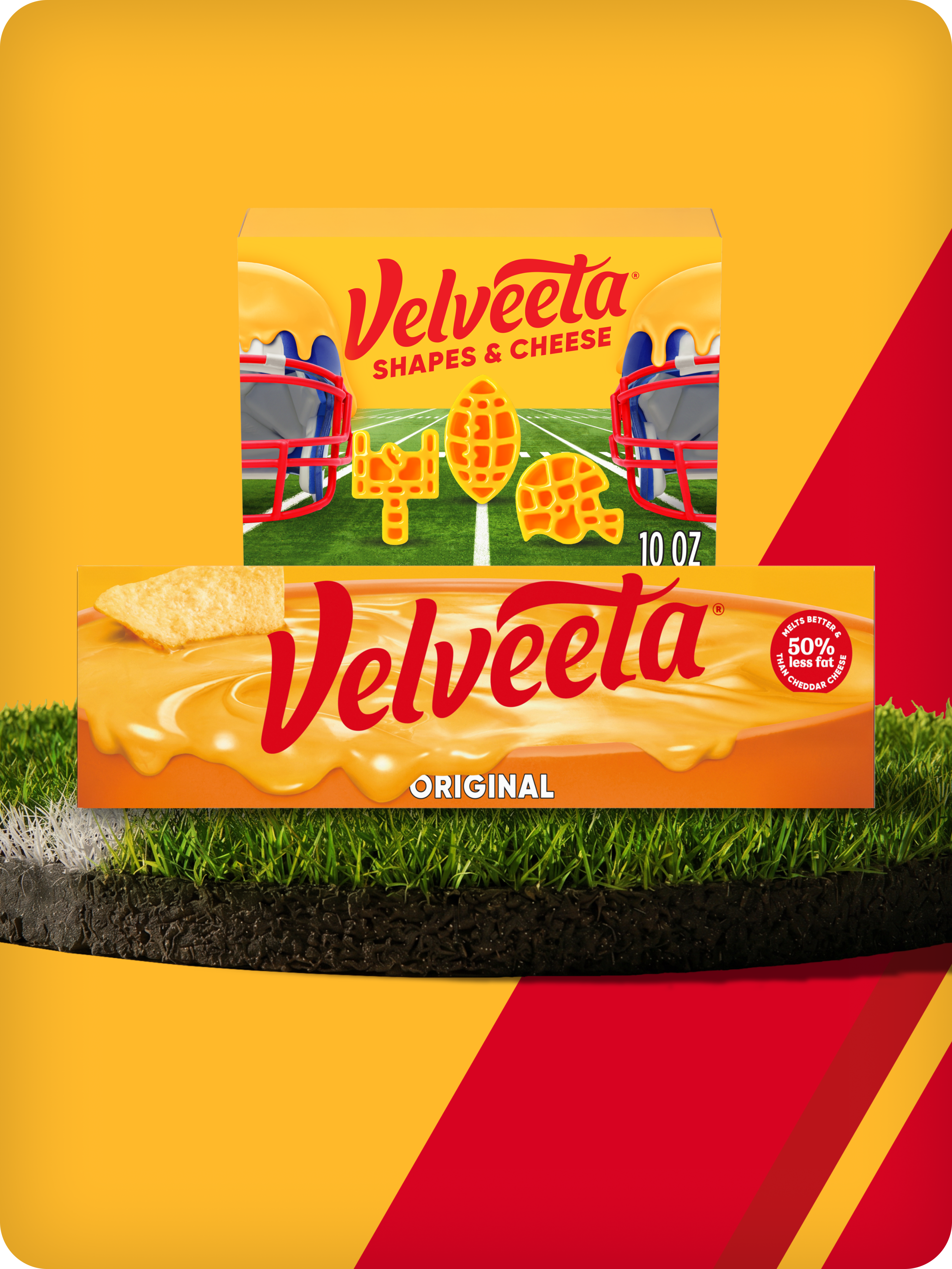 Velveeta Original cheese block and football-themed Shapes & Cheese boxes on stadium grass.