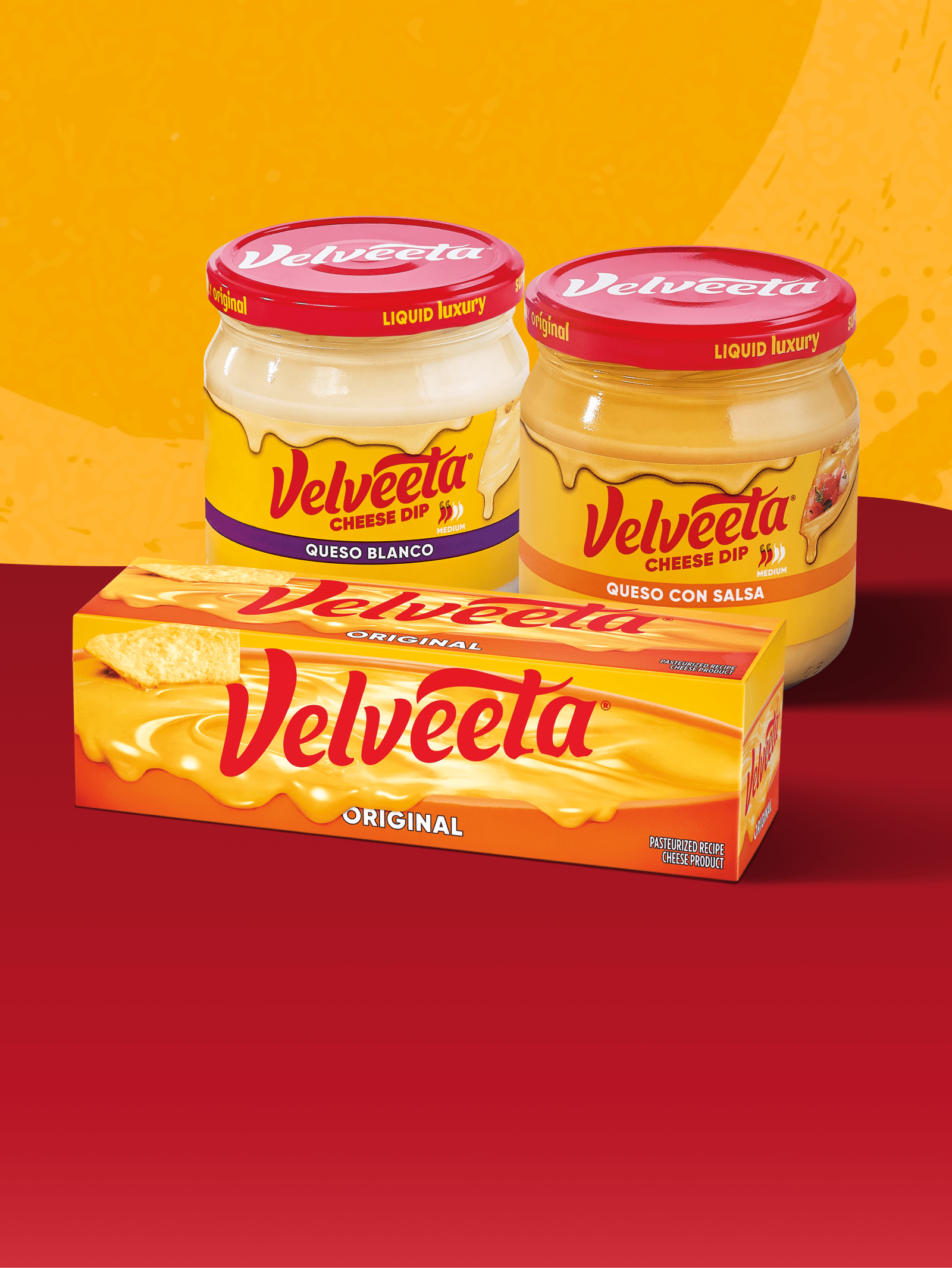 Velveeta Original cheese block, with Velveeta Queso Blanco and Queso Con Salsa dips.