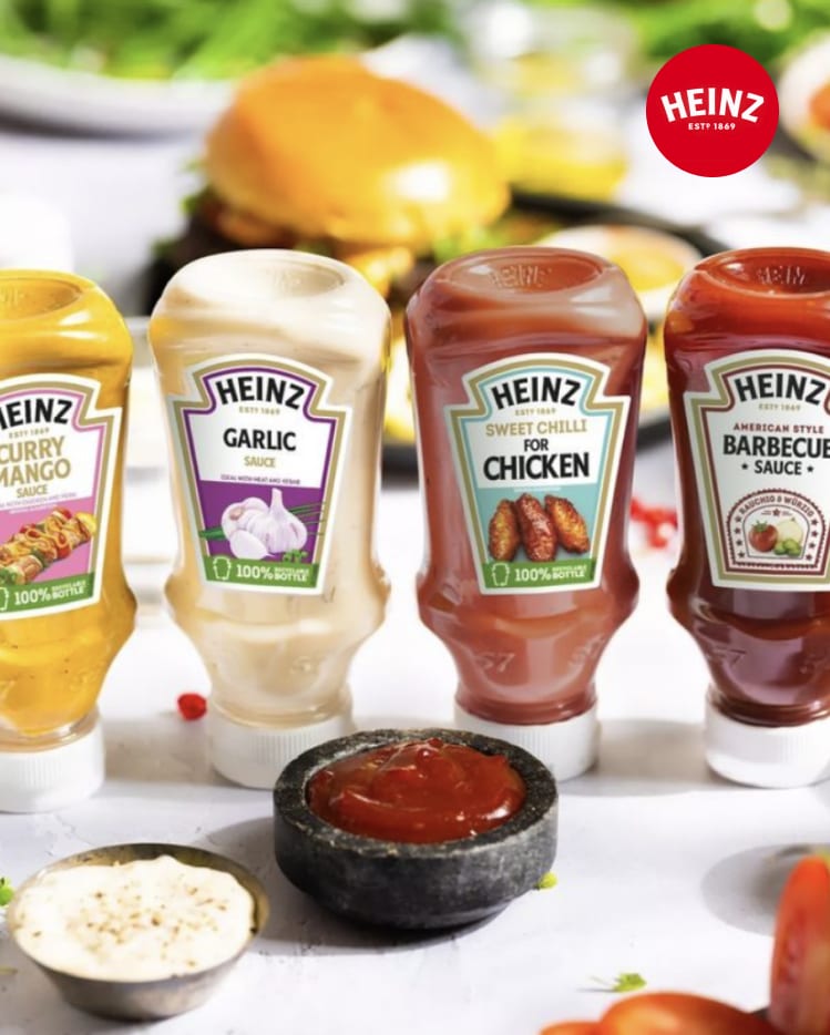 A variety of Heinz squeeze bottles, including Garlic and Sweet Chilli for Chicken.