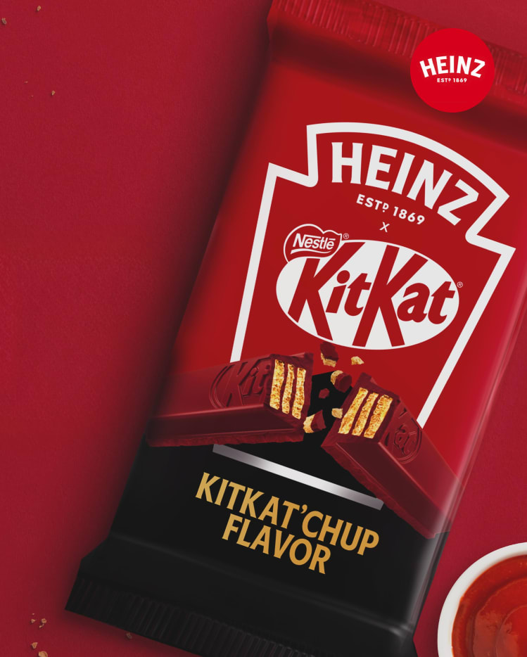 A red KitKat bar wrapper with Heinz branding for "KitKat’chup Flavor."