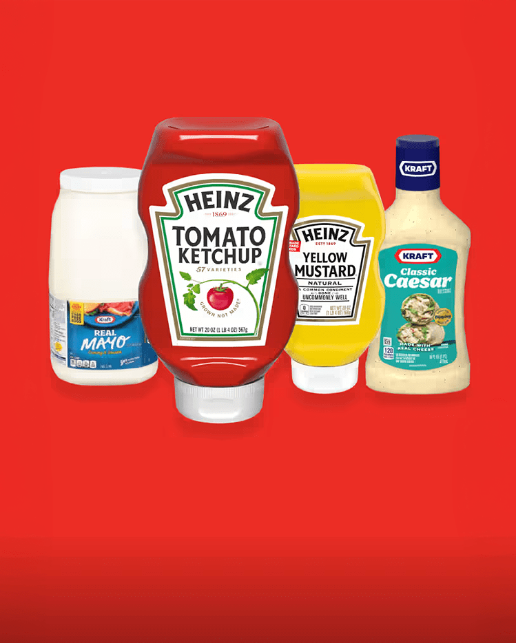Bottles of Kraft Mayo, Heinz Ketchup, Heinz Mustard, and Kraft Classic Caesar Salad Dressing.