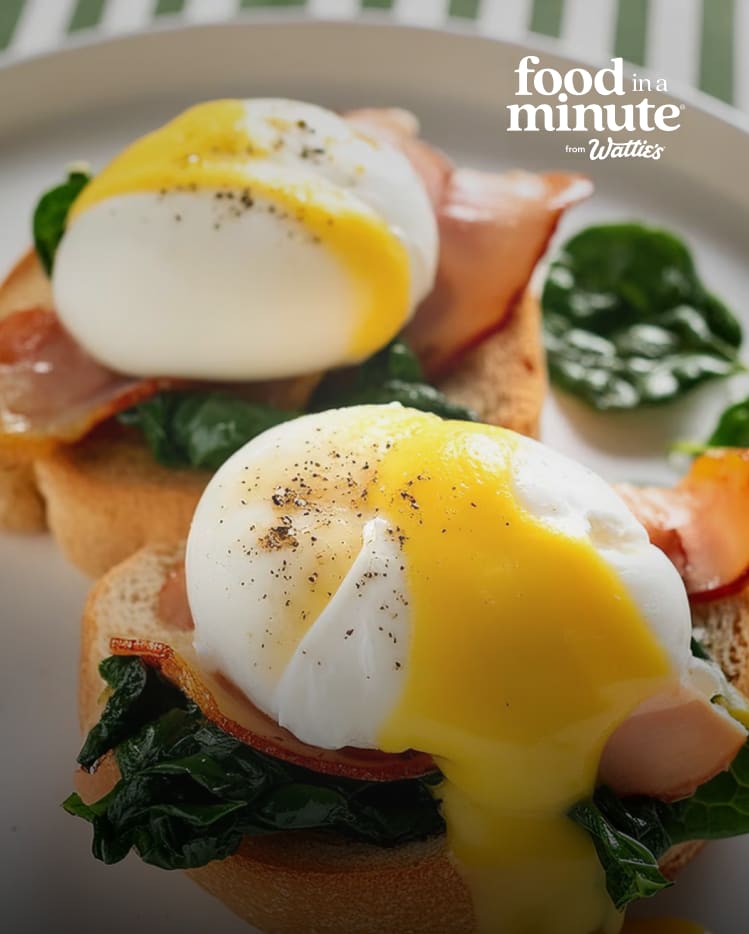 Two poached eggs with hollandaise and bacon on toast.