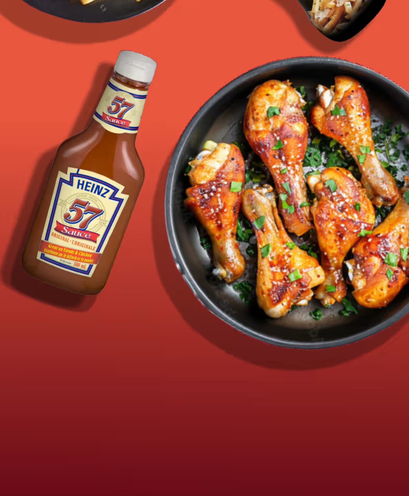 Heinz 57 Sauce next to plates of fried chicken and fries.