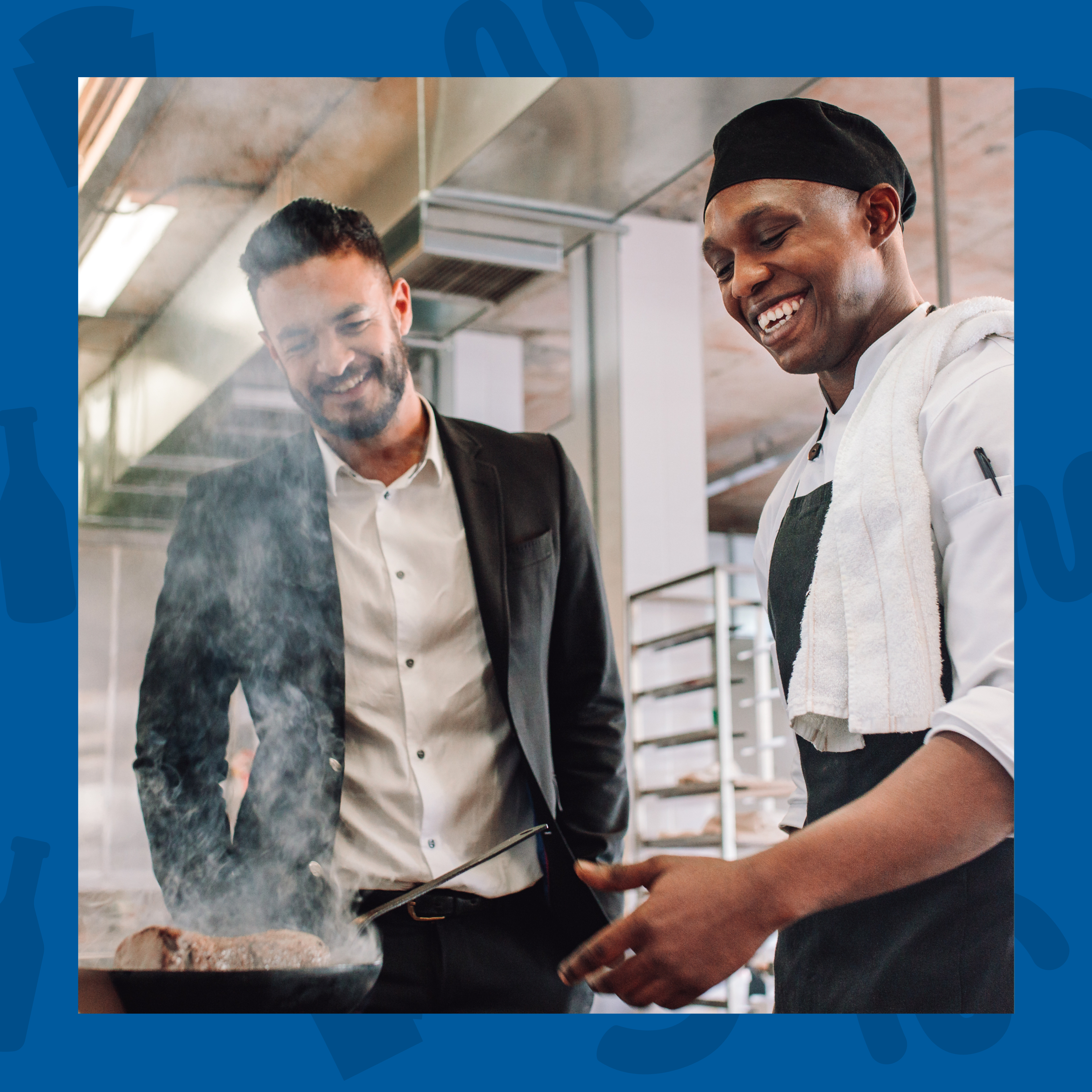 A chef and manager in a kitchen, reviewing food being cooked in a pan