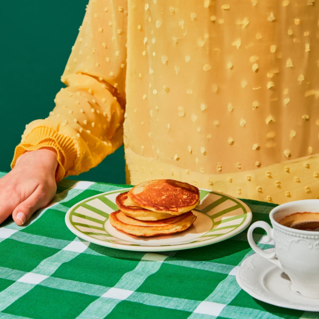 Pancakes served with coffee, representing the Kraft Heinz Away From Home brand's dedication to quality dining and customer sa