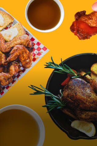 An overhead shot of a table with various Southern dishes, including fried chicken wings, cornbread, whole roasted chicken, an
