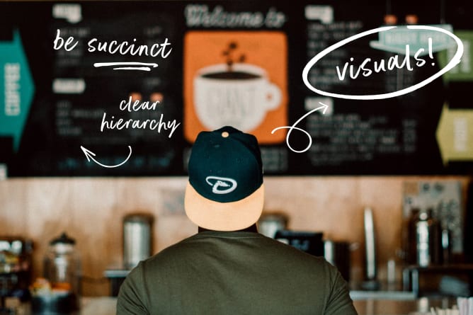 A person looks at a chalkboard with coffee-related visuals and handwritten advice for presentations: "be succinct," "clear hi