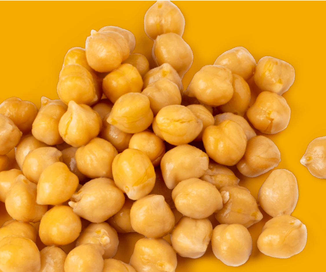 Pile of chickpeas on an orange background.