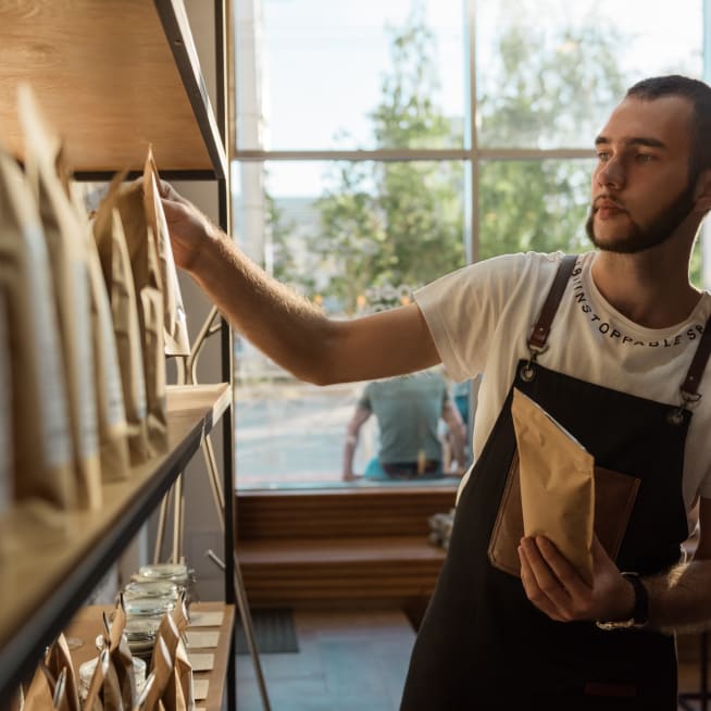 Man stacking product on a shelf