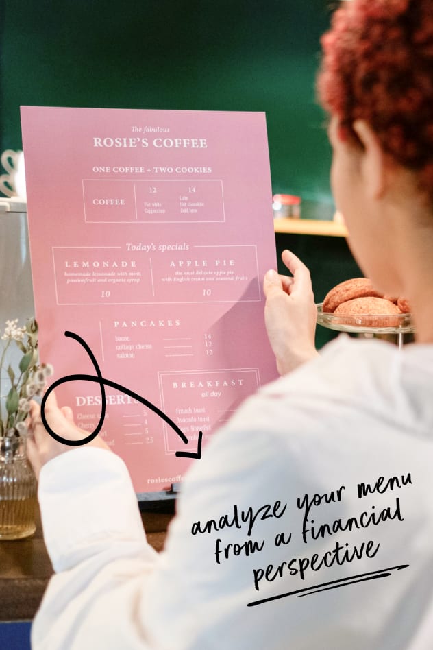 A person reviewing a menu from Rosie's Coffee, emphasizing menu analysis for financial insights.