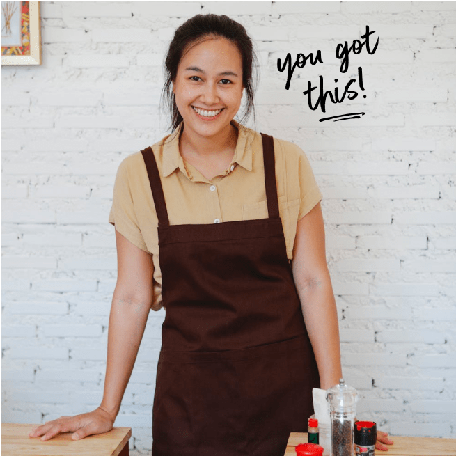 Smiling woman wearing apron