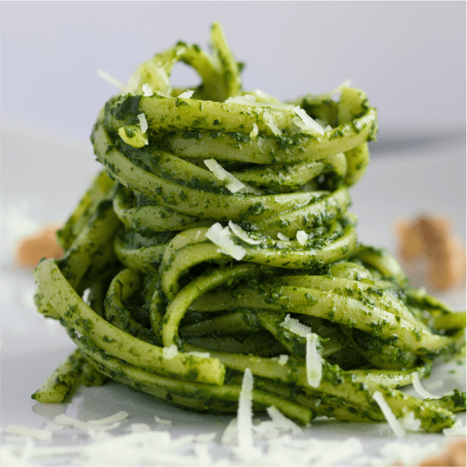 Pesto pasta with shredded cheese