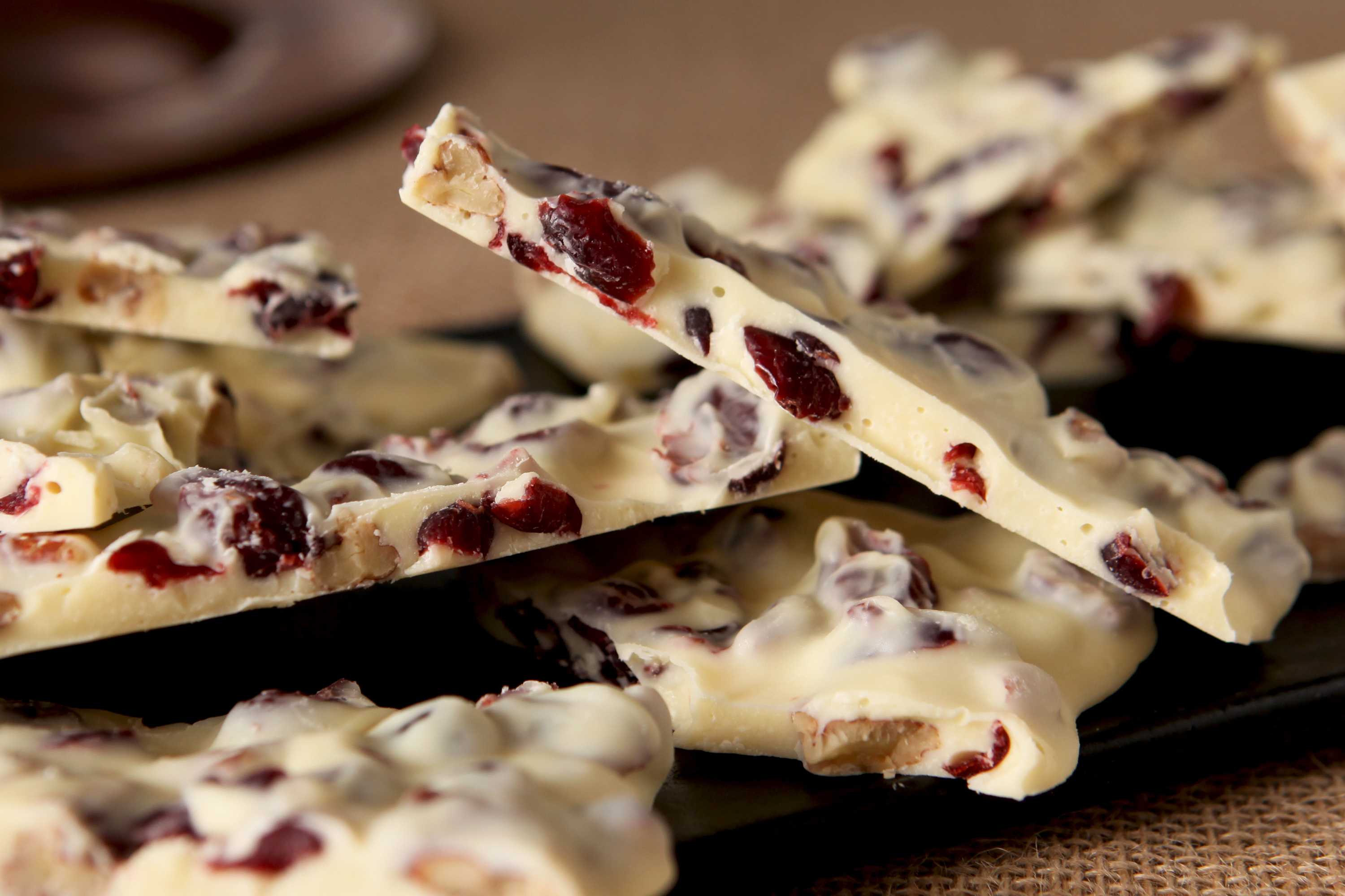 Shards of white chocolate bark loaded with dried red cranberries and nuts.