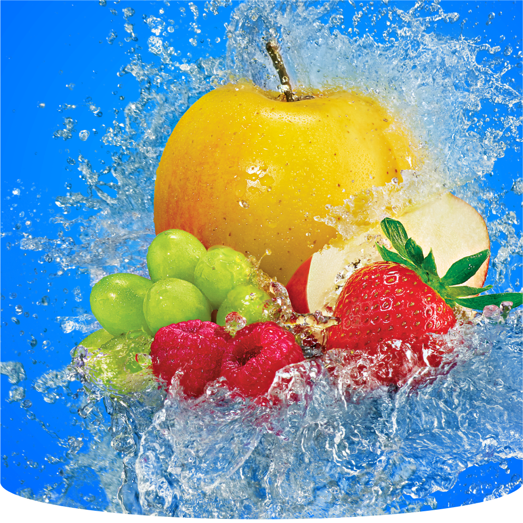 A golden apple, strawberry, raspberry, and green grapes with water splashing.