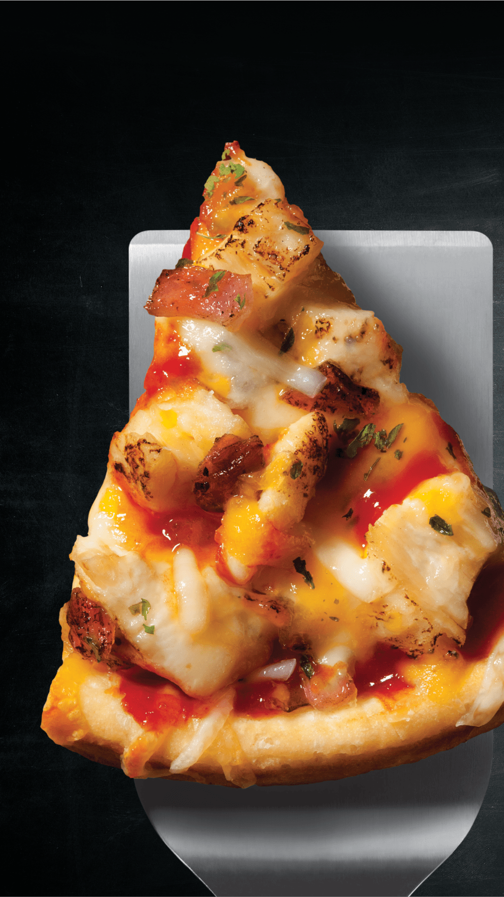 A slice of pepperoni pizza on a serving spade.