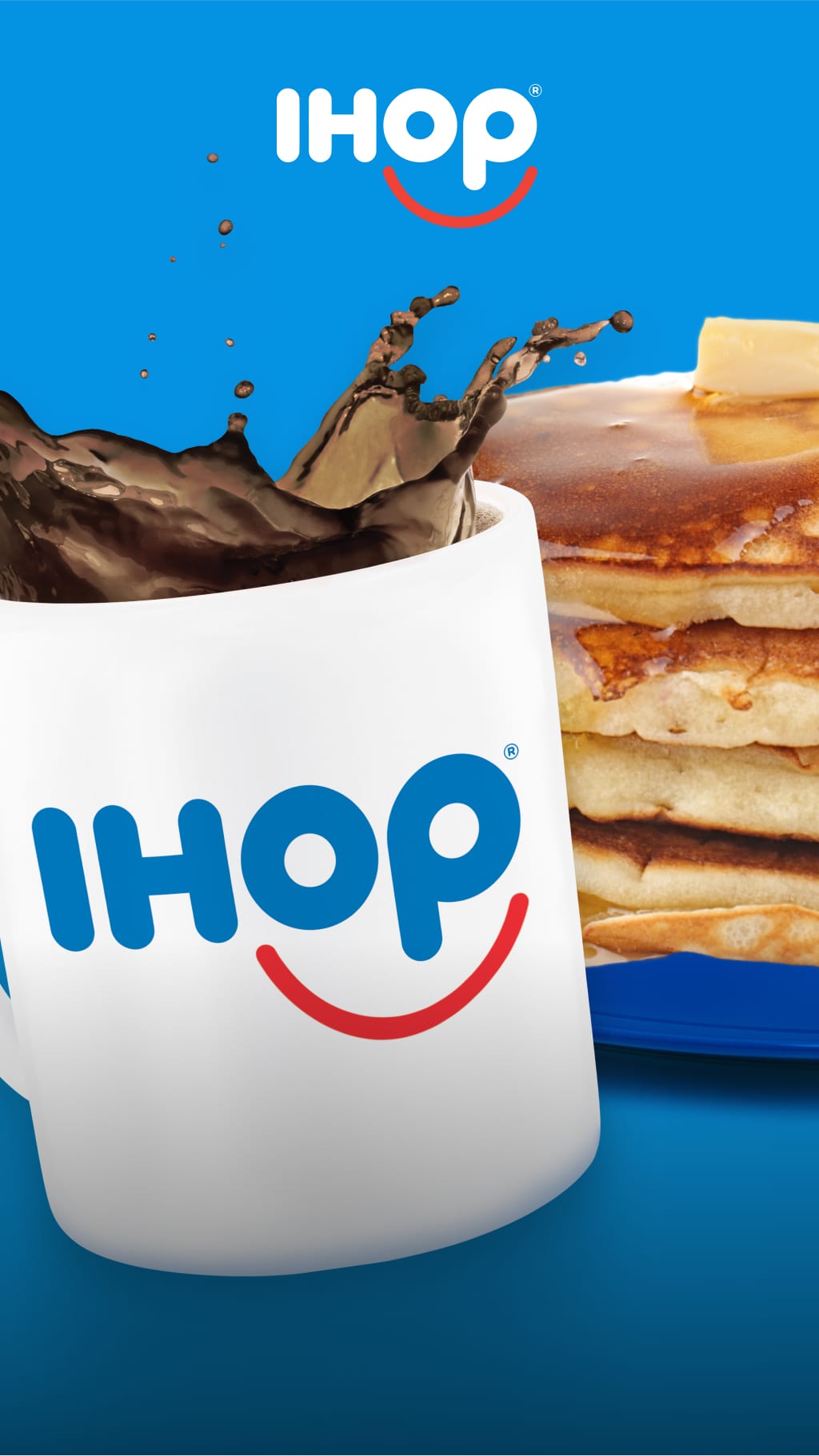 Stack of pancakes with butter and syrup next to a cup of coffee.