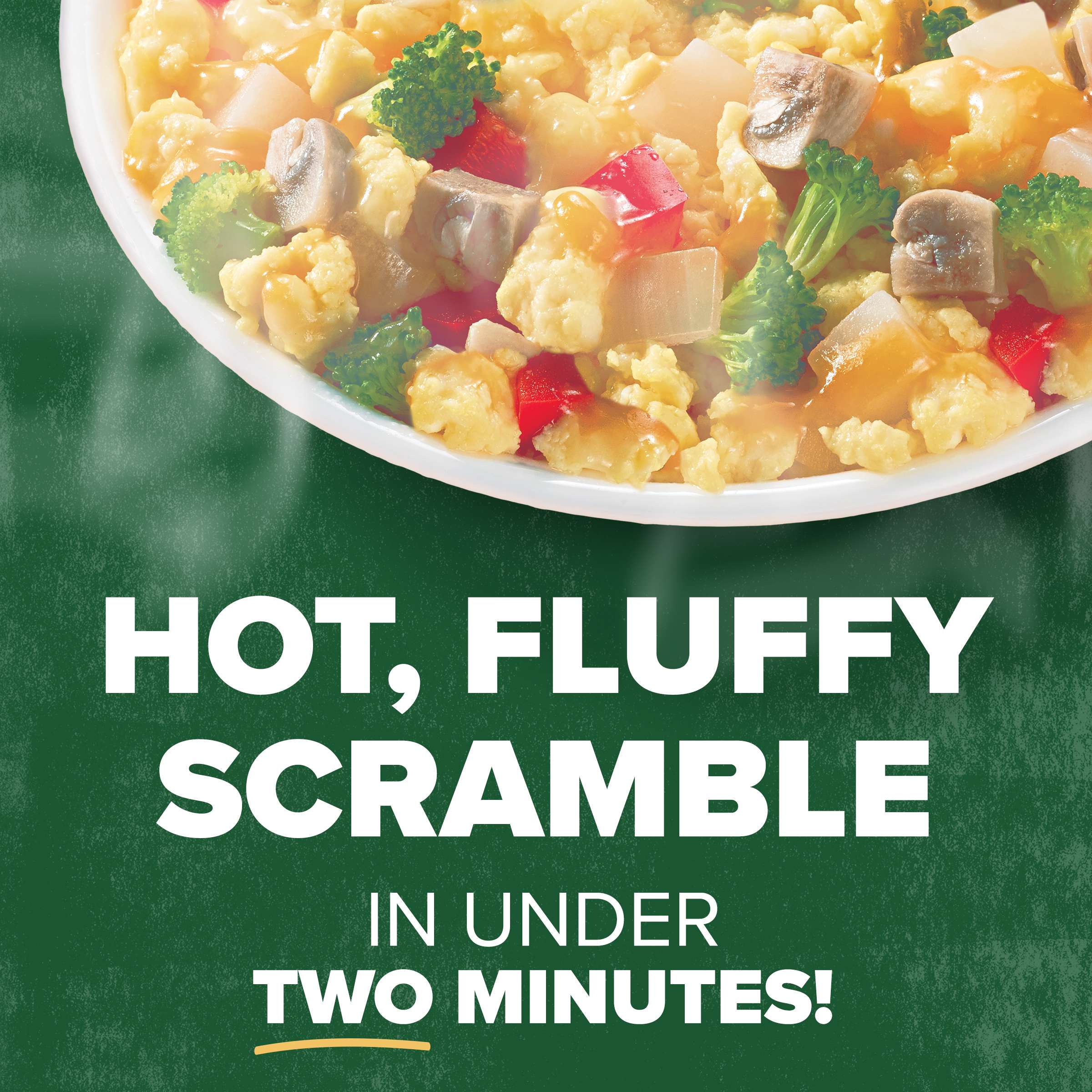 Photo of a bowl of scrambled eggs, vegetables, and gravy.