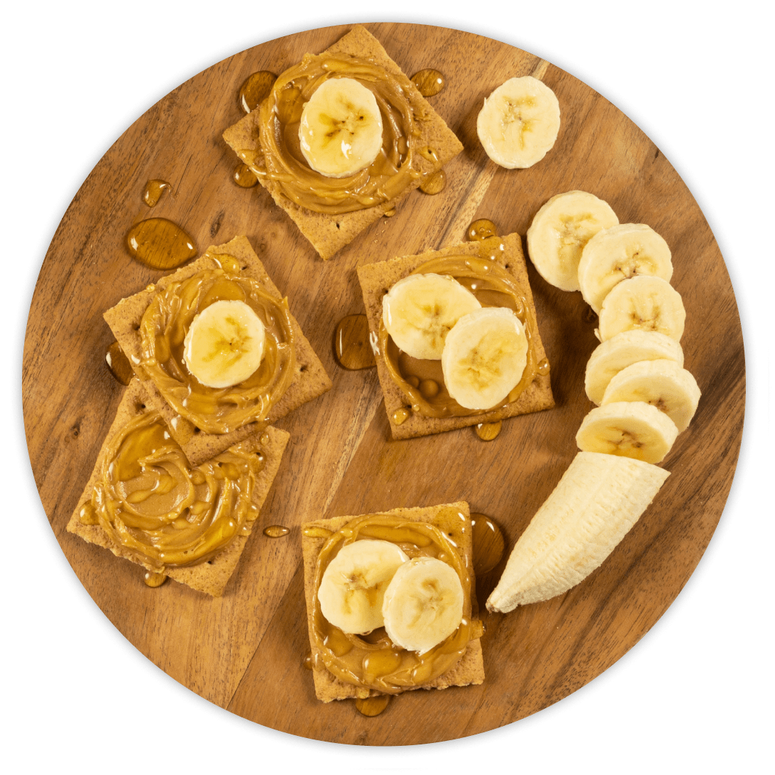 Crackers with peanut butter, banana, and honey.