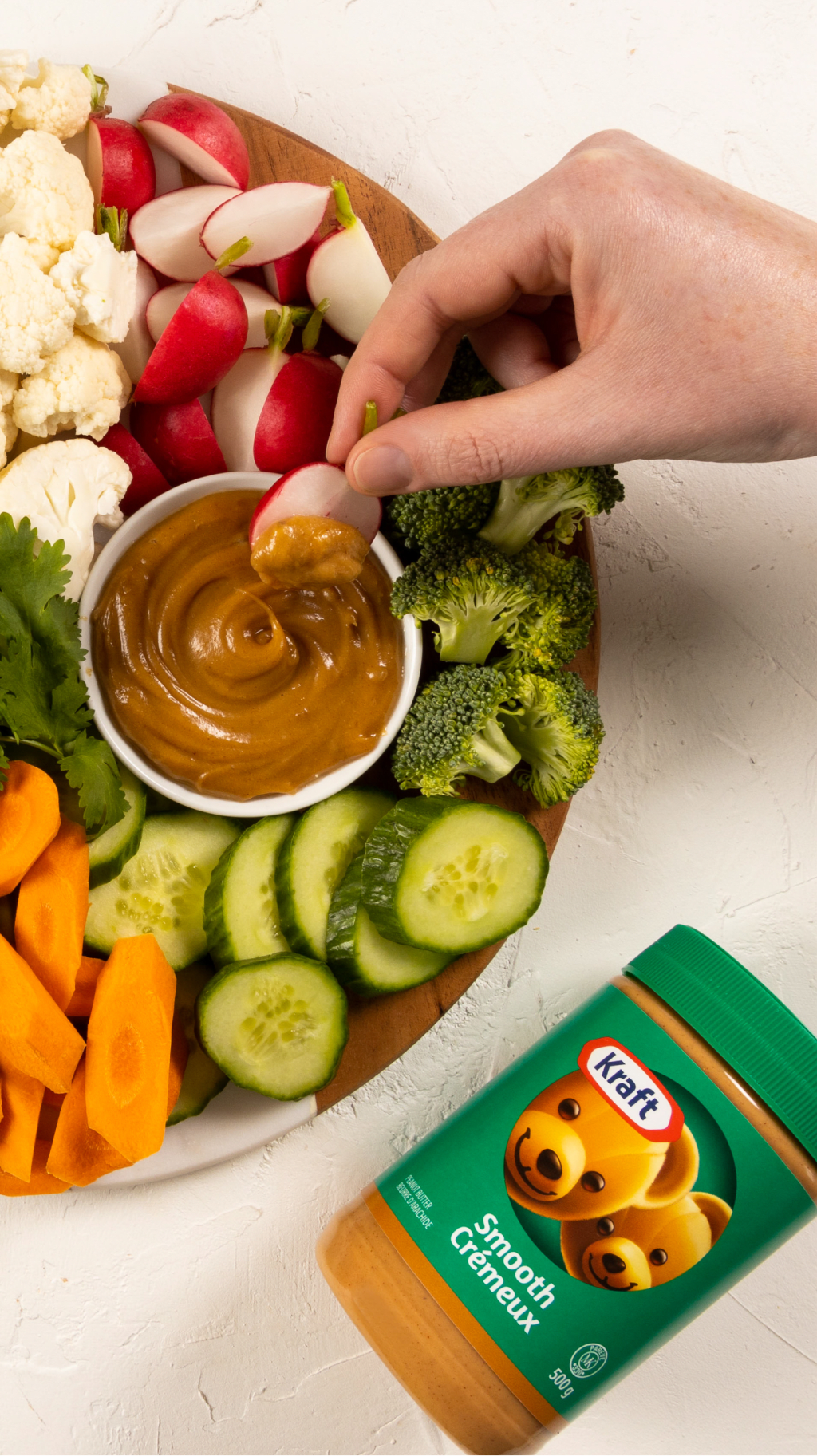 Veggie platter with peanut butter dip. Carrots, broccoli, peppers, radishes, cauliflower, cucumbers.