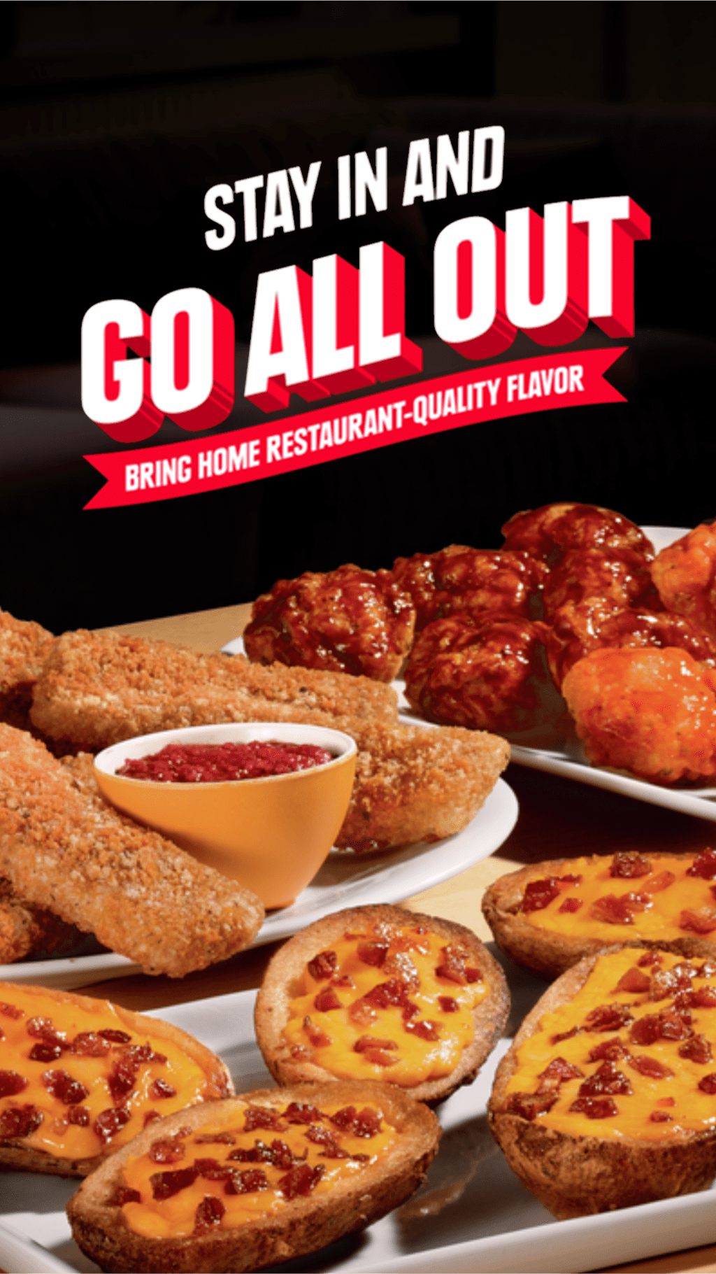 Delicious appetizers: chicken tenders, potato skins, and sauced meatballs.