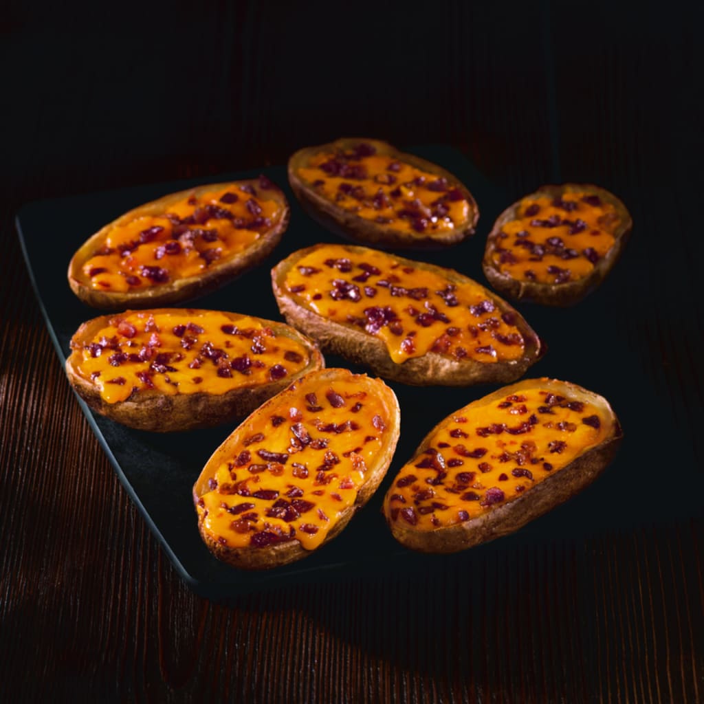 Loaded potato skins with cheese and bacon.