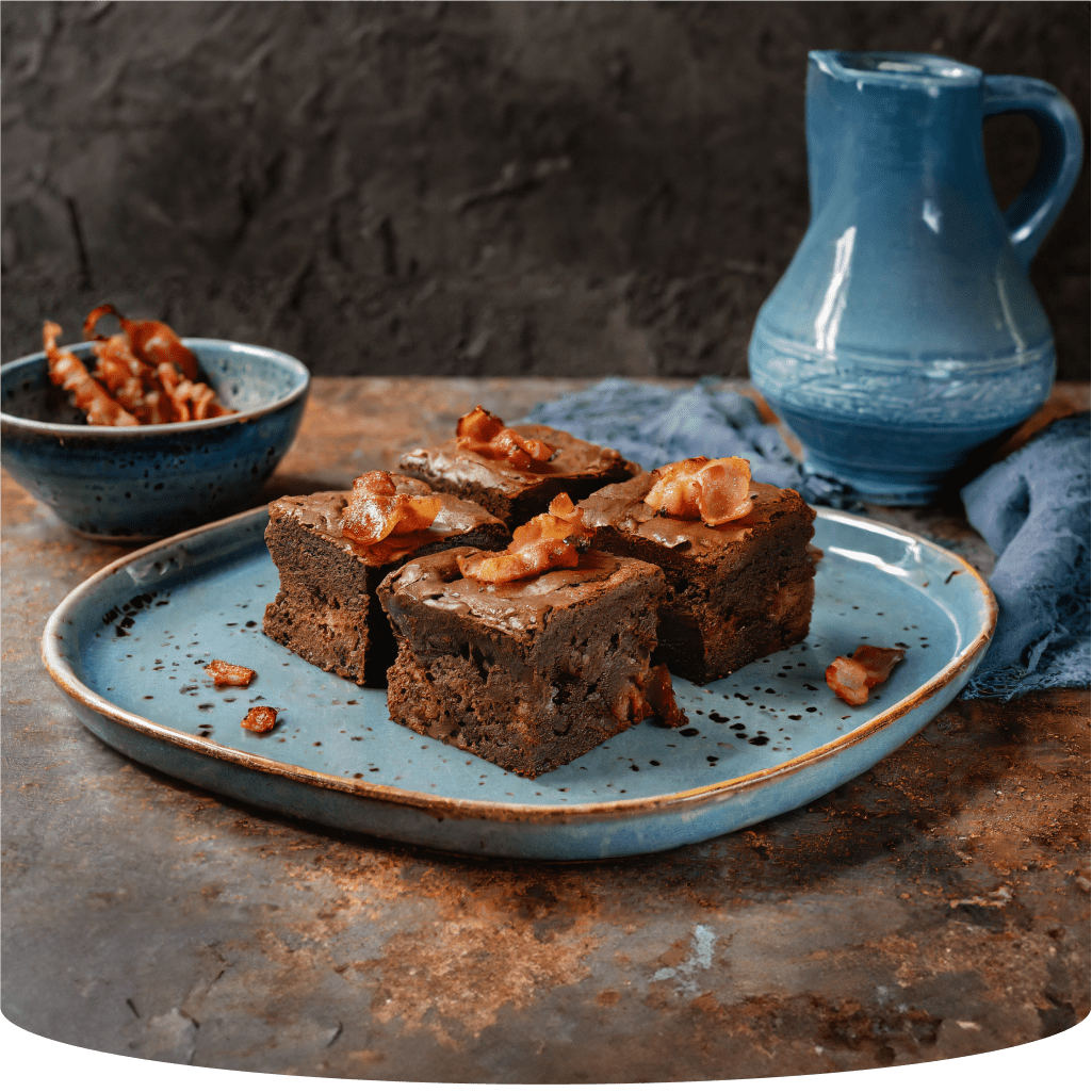 Brownies with topping on a blue plate.
