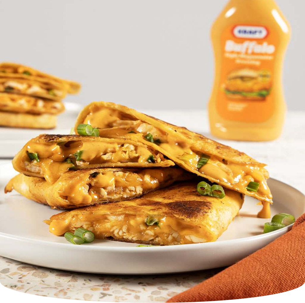 Stack of chicken quesadillas with Kraft Buffalo dressing.