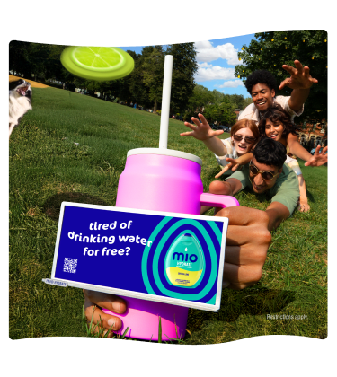 Ad for Mio Hydrate drink with a group of people in a park.