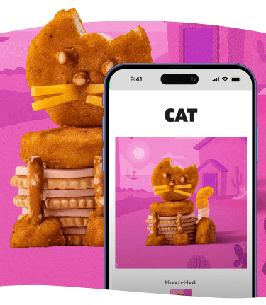 Food cat sculpture on a pink background.