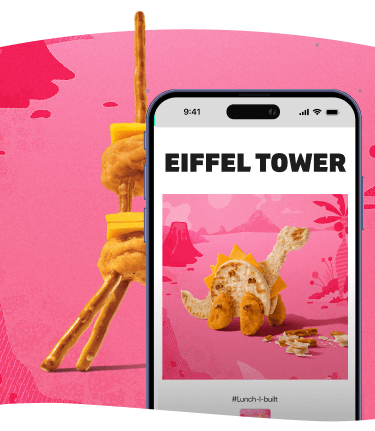 Eiffel Tower made of pretzels, cheese, and chicken nuggets on a phone screen.