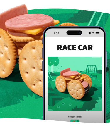 Crackers stacked with meat & cheese, styled as a playful food creation.