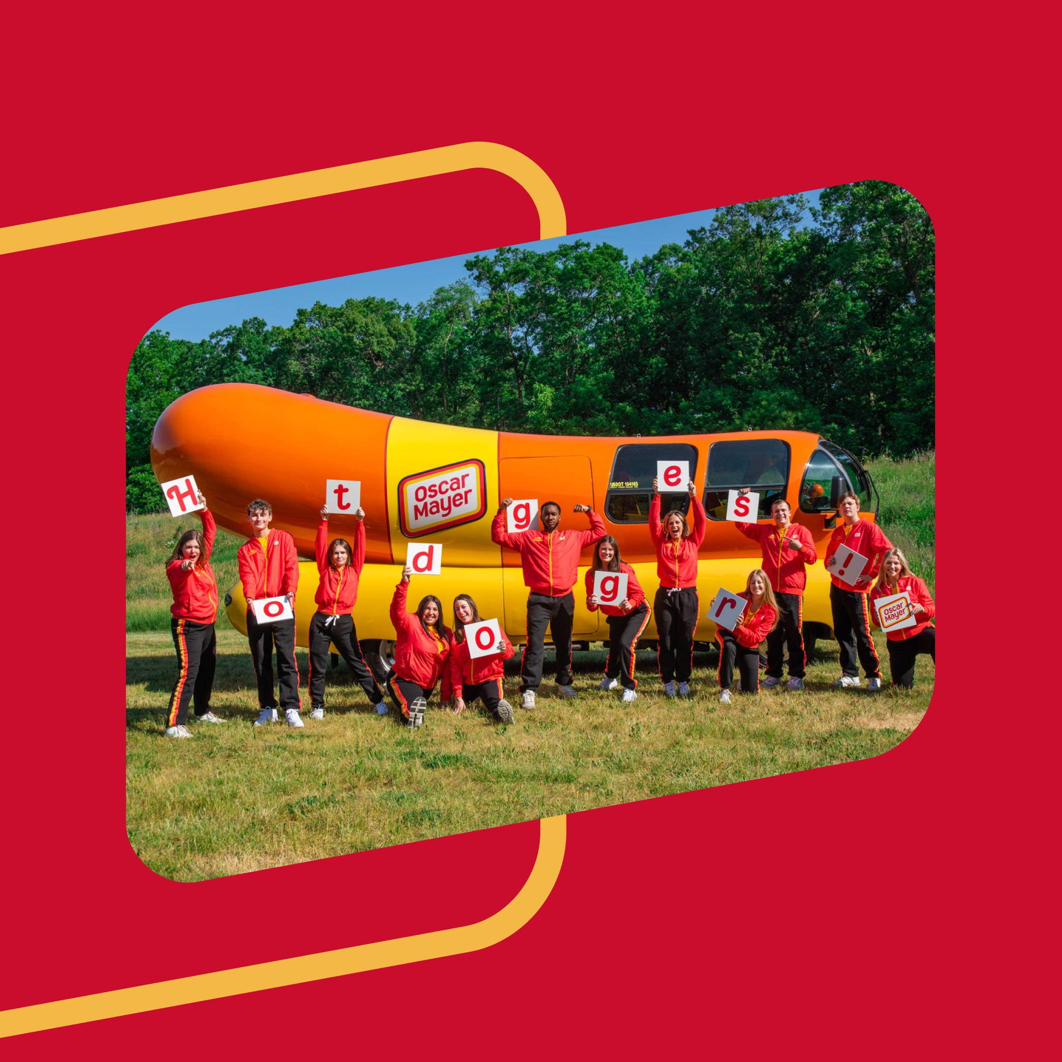The Oscar Mayer Wienermobile is pictured with a team of Hotdoggers in uniform, each holding a letter which spells the word 'H