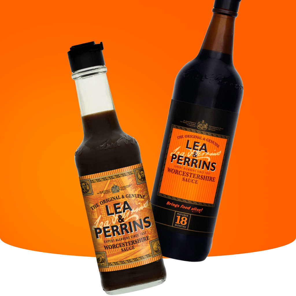 Two bottles of Lea and Perrins Worcestershire sauce on an orange and white background.